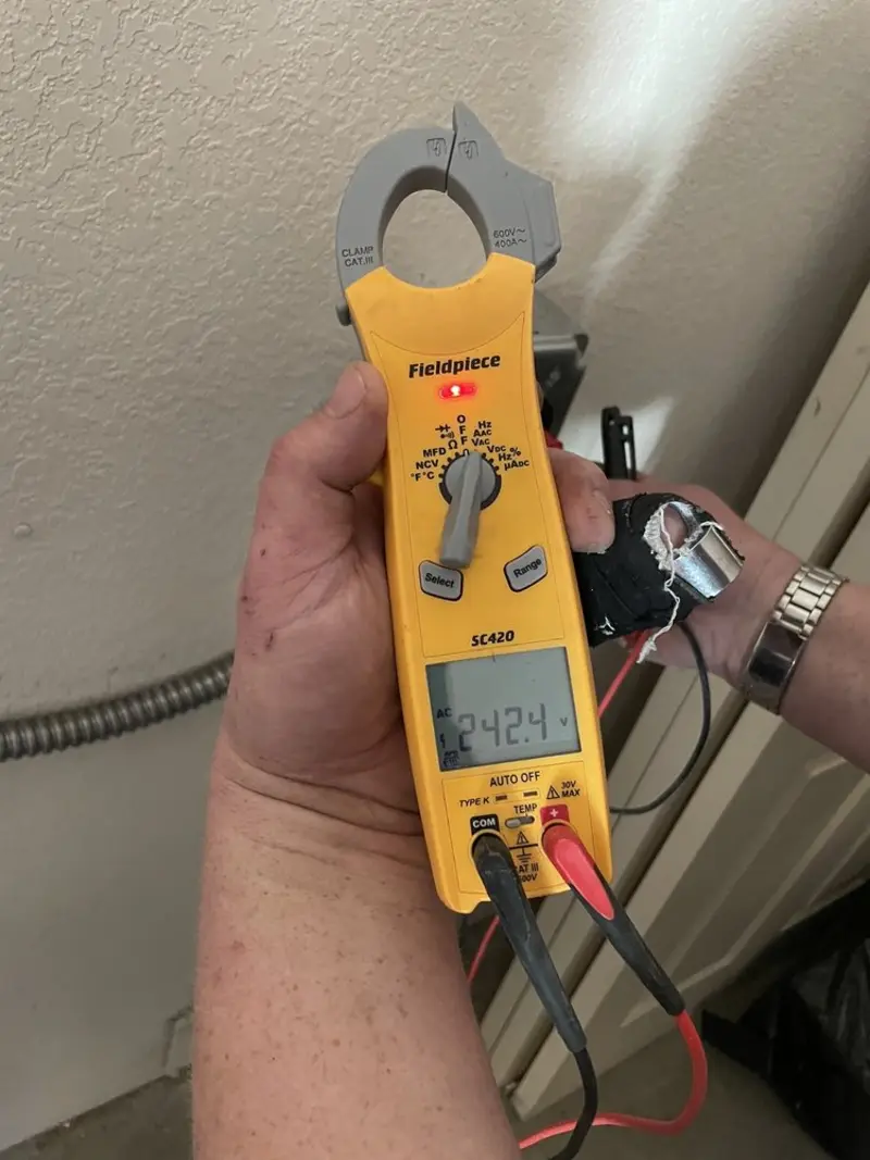 Voltage testing with clamp meter during Outlet Installation in Belmont